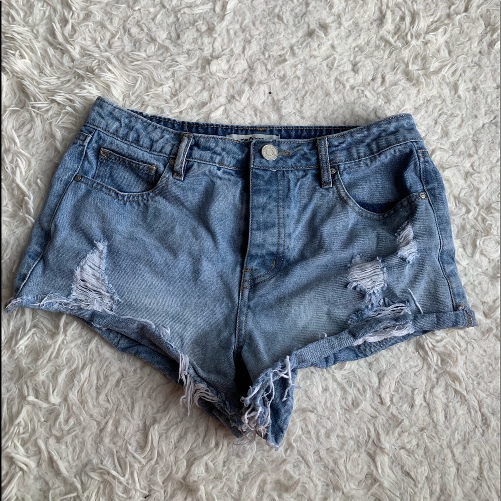 Distressed cheeky jean shorts